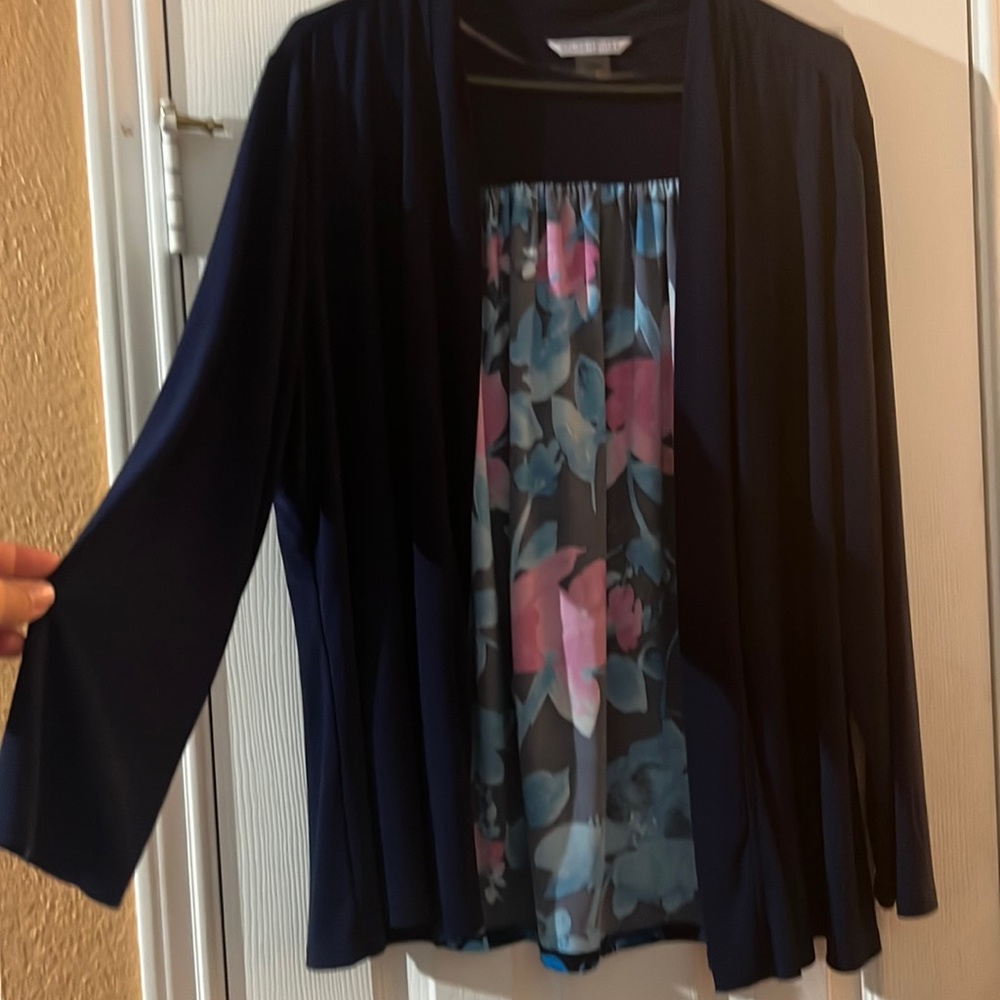 Gorgeous open-front cardigan with flower design on the back.